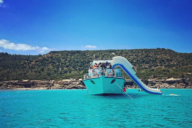 Blue Lagoon trip with slide & music departing from Latchi harbour - Manolis Bay and the fisherman’s cave