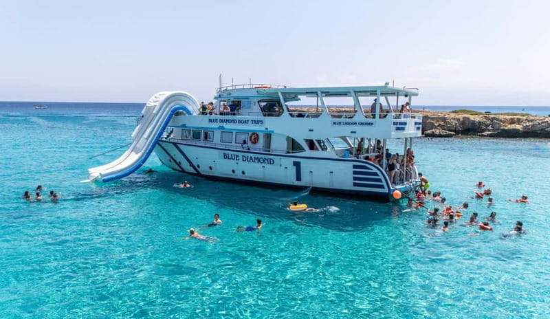 FROM LATCHI: Blue Lagoon Akamas Cruise - large water slide - Passing the Baths of Aphrodite