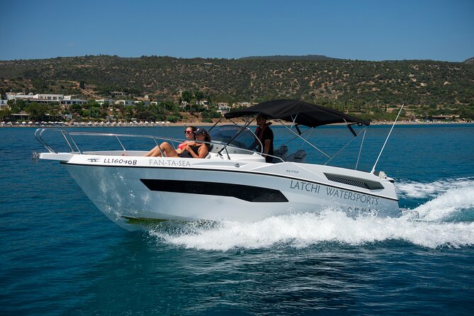 Karnic SL702 boat with driver, WC,Cabin, BT music and shower - Taking the helm at Latchi Watersports Centre