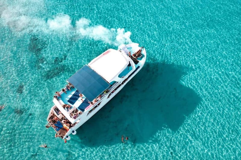 Paphos: Blue Lagoon Afternoon Cruise with Swim, BBQ & Wine - Sunset on the return cruise