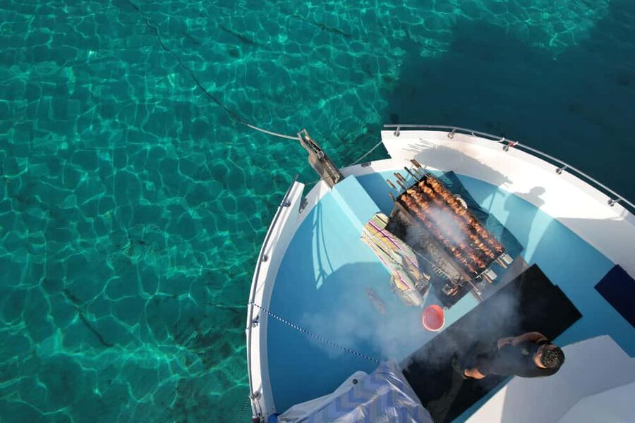 Paphos: Blue Lagoon Afternoon Cruise with Swim, BBQ & Wine - Boarding the boat at Latchi